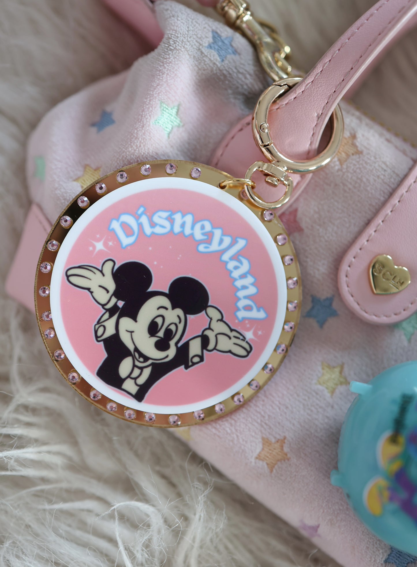 An original pink bag charm